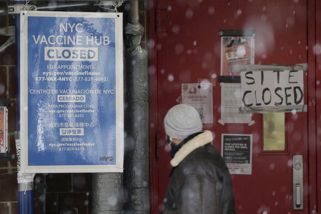 An NYC Vaccination Hub Closed sign hangs outside of a school used to distribute coronavirus vaccine in New York City on January 26, 2021.